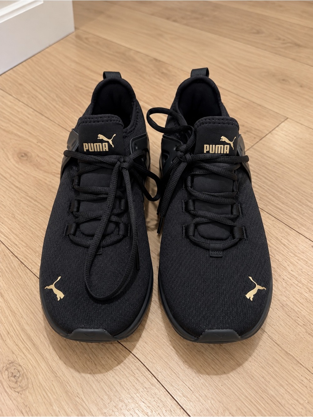 Puma Women’s Black Sneakers with Gold Accents Size 7
